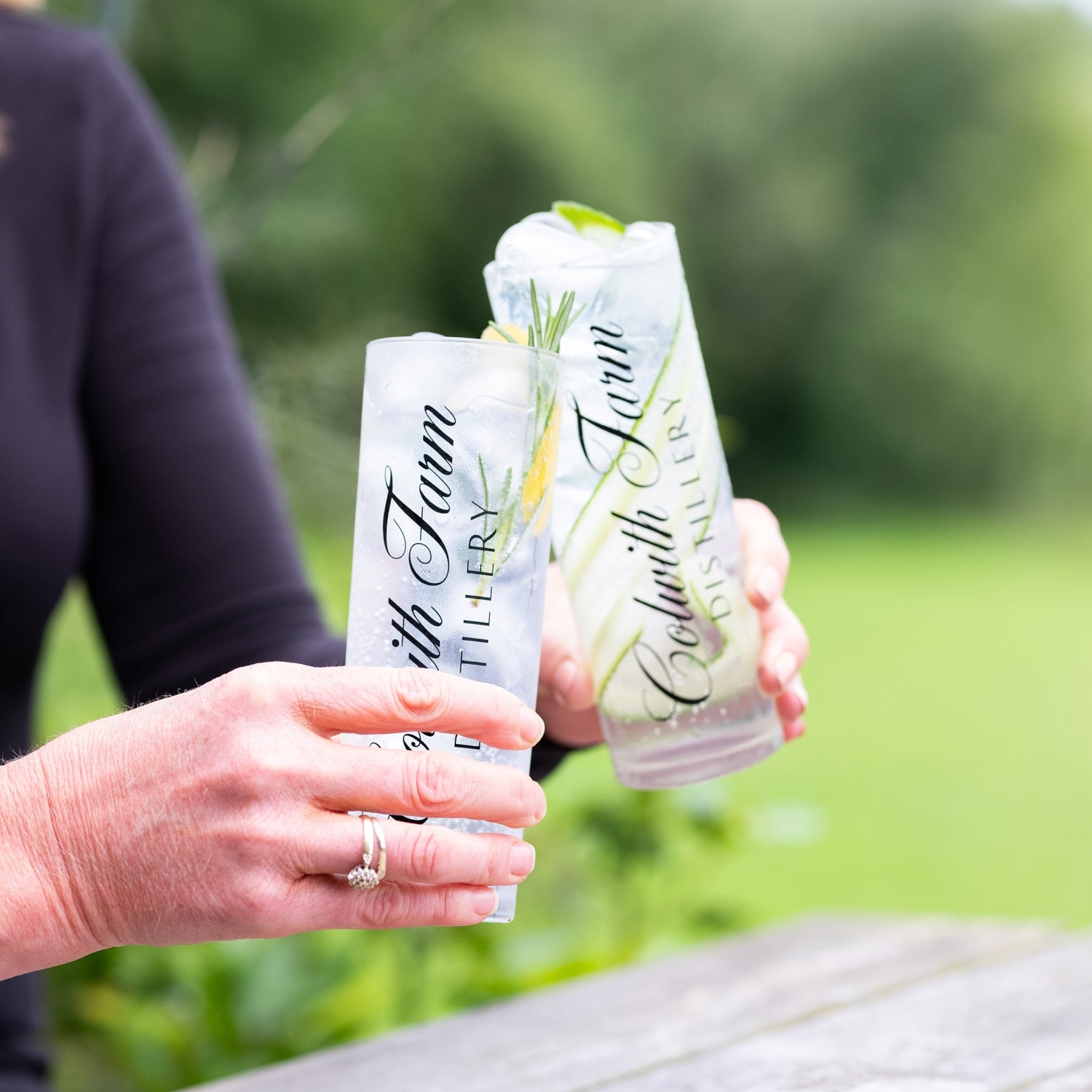 Two chilled Aval Dor vodka sodas raised together outdoors